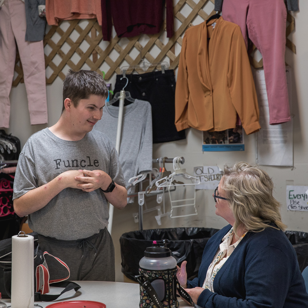 An adult worker with developmental disabilities works at The Wearhouse Thrift Store in Waterville, KS. The Wearhouse helps fund TVDSI's programs and it offers fulfilling and social job opportunities to people with intellectual or developmental disability.